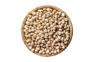 Raw Chickpeas in bowl. Nutritious food. Healthy and vegetarian food. Isolated on white background. Top view. photo