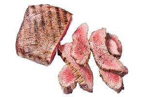 Roast sliced Flank or Flap Steak on a butcher cleaver with thyme and pink salt. Isolated, white background. photo