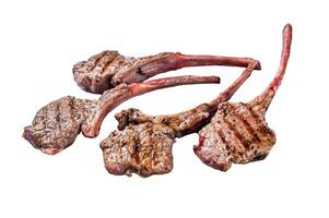 Grilled lamb mutton meat chops steaks. Isolated on white background, top view. photo