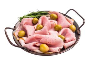 Meat appetizer with Sliced Prosciutto Cotto ham and green olives isolated on white background. top view photo