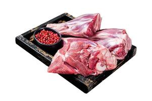 Fresh Raw lamb shanks with herbs and spices, mutton meat. Isolated on white background. Top view. photo
