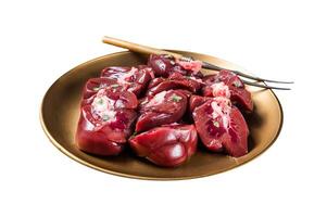 Lamb kidney, raw sliced offal on plate with thyme. Isolated on white background. Top view. photo