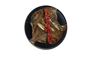 Roasted Flatfish or Flounder in a tomato sauce. High quality Isolate, white background. photo