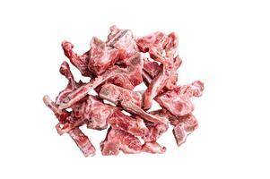 Raw meat on the bone diced for stew. Isolated on white background photo