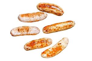 Grilled assorted pork, beef and chicken sausages with spices Isolated on white background. Top view. photo