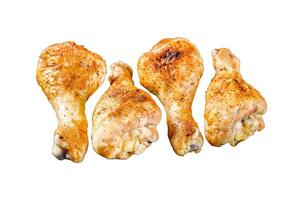 Roasted spicy chicken drumstick, shanks with spices and herbs. Isolated on white background. Top view. photo