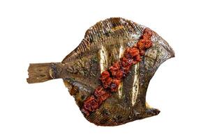 Grilled Flounder or plaice with tomato sauce on wooden cutting board. Isolated background photo