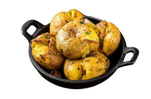 Crushed, Broken potatoes baked in oil with herbs. Isolated on white background. Top view photo