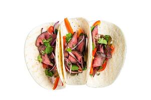 Homemade Mexican Steak Steet Tacos with Cilantro, green sauce, jalapenos and onion. Isolated on white background. photo