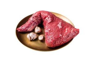 Raw tri-tip triangle roast or bottom sirloin steak on plate with herbs. Isolated on white background. Top view. photo