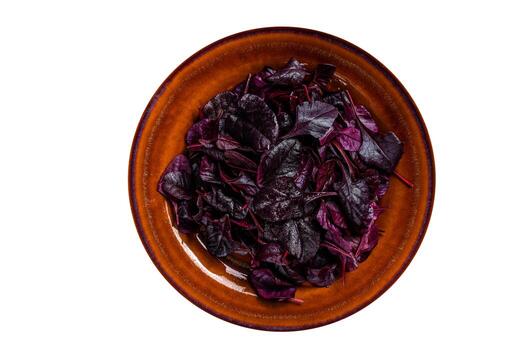 Raw Ruby or red chard salad Leafs on a rustic plate. High quality Isolate, white background. photo