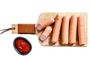 Classic chicken sausages on a cutting Board with rosemary and spices. Isolated on white background. Top view. photo