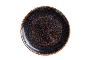 Empty black craft plate on table. Table setting. Isolated on white background photo