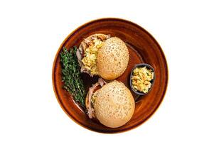 Pulled Pork meat Hamburger with coleslaw salad. Isolated on white background. photo