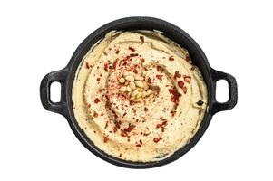 Hummus dip with chickpea in a bowl. Isolated on white background. photo