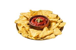 Nachos chips with tomato sauce and jalapeno, mexican appetizer. Isolated on white background. Top view. photo