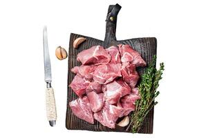 Fresh Raw Diced pork cubs meat with spices Isolated on white background, top view. photo