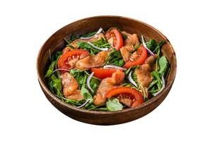 Vegetable salad with smoked salmon, arugula, tomato and green vegetables. Isolated on white background. Top view. photo