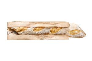 French baguette in a paper bag. Isolated on white background. Top view. photo