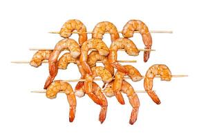 Grilled shrimps prawns on skewers with spices, herbs. Isolated on white background, top view. photo