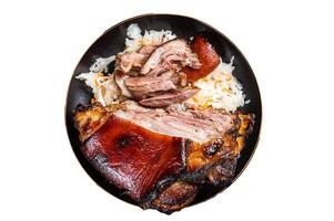 Roast Pork Ham Hock, knuckle with Sauerkraut on a plate. Isolated on white background. photo
