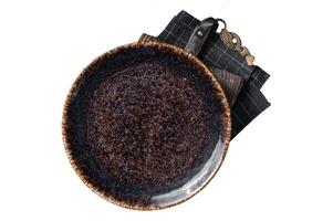 Table setting with vintage empty black plate on rustic wood. Isolated, white background. photo