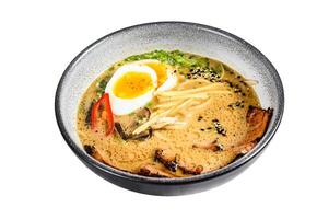 Ramen asian noodle soup with Beef tongue meat, mushroom and Ajitama pickled egg. Isolated on white background. Top view. photo