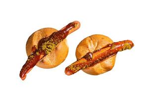 Deutsche Bockwurst sausage in a bun with French fries and curry sauce, currywurst. Isolated on white background photo