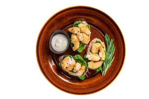 Sandwichs with Fried Shrimps, Prawns, spinach and chard salad on a rustic plate. D Isolated on white background. photo