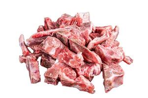 Raw meat on the bone diced for stew. Isolated on white background photo