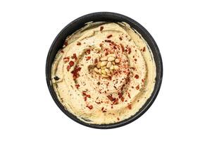 Hummus dip with chickpea in a bowl. Isolated, white background. Top view. photo