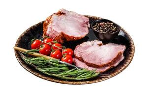 Smoked pork meat - gammon with herbs on rustic plate Isolated on white background, top view. photo