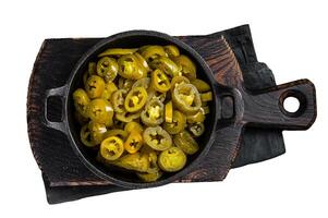 Pickled Green Sliced Jalapenos in a pan. Isolated on white background, top view. photo