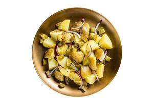 Warm Potato salad with red onion, capers, greens in a plate. Isolated on white background. photo