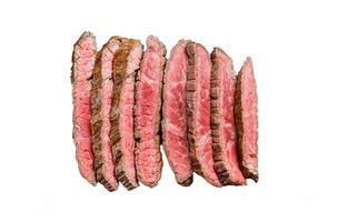 Grilled and sliced Flank rare steak. Marble beef meat. Isolated on white background. Top view. photo