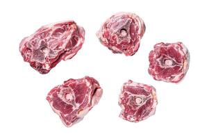 Raw lamb neck meat on cooking table.. Isolated on white background, top view. photo