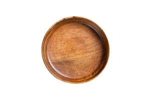 Table setting with vintage empty wooden plate on rustic wood. Isolated on white background. photo