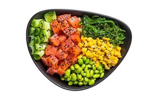 Salmon Poke bowl with Cucumber, Edamame, and Rice. Isolated on white background. photo