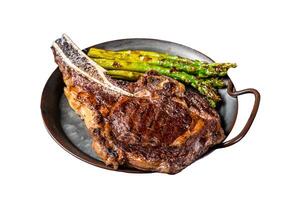 BBQ Grilled Tomahawk or Cowboy with bone beef steak, roasted asparagus. Isolated on white background. Top view. photo