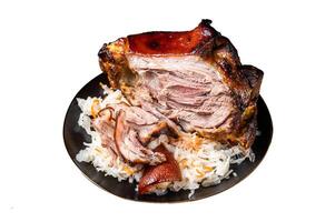 Roast Pork Ham Hock, knuckle with Sauerkraut on a plate. Isolated on white background. Top view. photo
