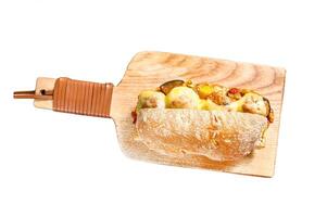 Submarine sandwich with meatballs. Isolated on white background. Top view. photo