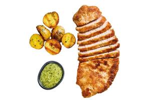 Homemade breaded german weiner schnitzel with potatoes Isolated on white background. Top view. photo