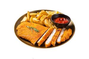 Breaded german weiner schnitzel with potato wedges. Isolated on white background. Top view. photo