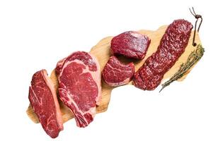 Variety of raw black angus beef meat steaks fillet Mignon, rib eye or cowboy, Striploin or new york, skirt or machete. Isolated on white background. photo