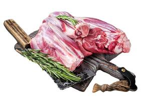 Uncooked Raw lamb mutton shanks on a butcher board. Isolated, white background. photo