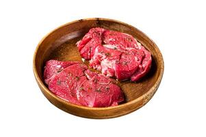 Fresh Mutton chop leg steaks, uncooked lamb meat with herbs. Isolated on white background. Top view. photo