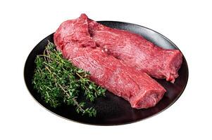 Halal fresh lamb tenderloin meat, Mutton sirloin fillet with thyme. Isolated on white background. Top view. photo