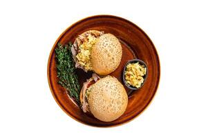 Pulled Pork meat Hamburger with coleslaw salad. Isolated on white background. photo