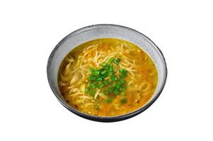 Fresh homemade chicken soup with noodle Isolated on white background, top view. photo