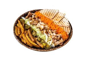 Chicken Shawarma Doner kebab on a plate with french fries, vegetables and salad. Isolated on white background. photo